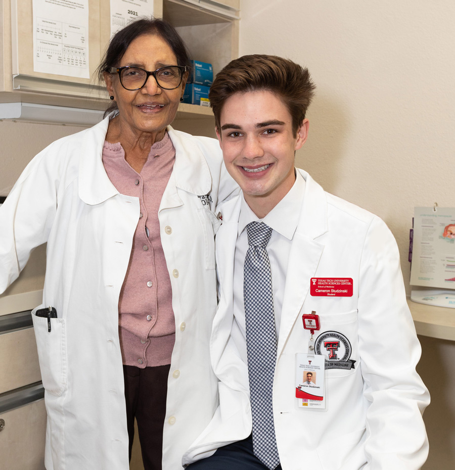 Cameron Studzinski, a first-year medical student, with Kamlesh Varma, MD, the obstetrician who delivered him  in 1999.