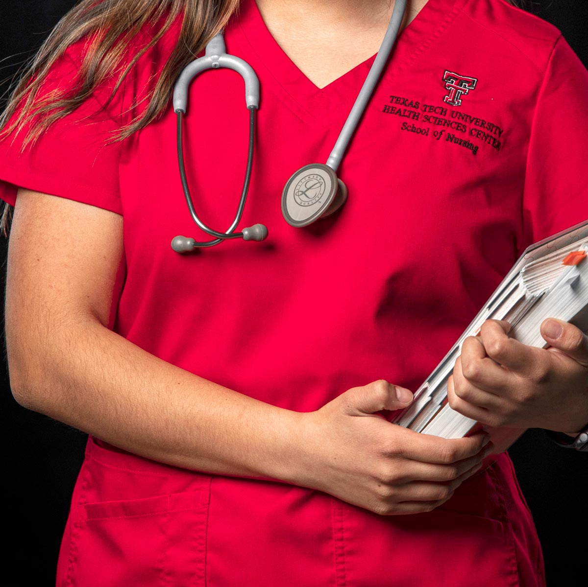 First class nurse holding papers