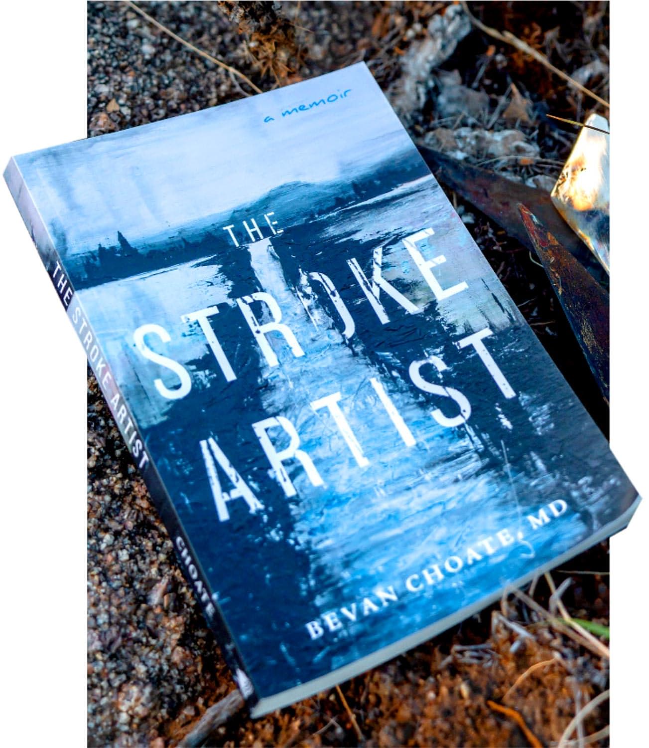 a copy of The Stroke Artist sits on the ground