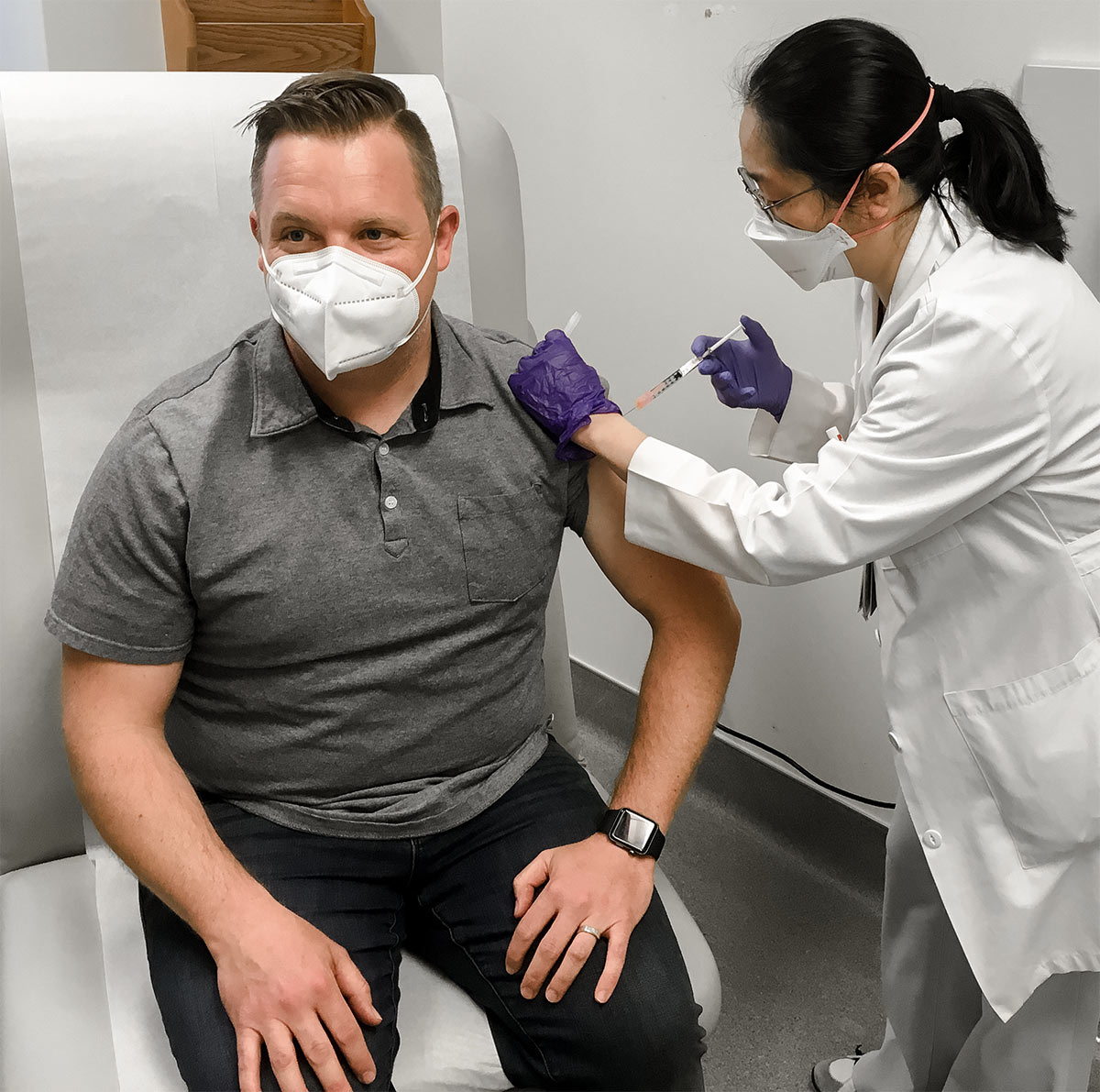 A study participant receives the first-ever shot of the SchistoShield investigational vaccine at Kaiser Permanente Washington Health Research Institute on May 23, 2022.