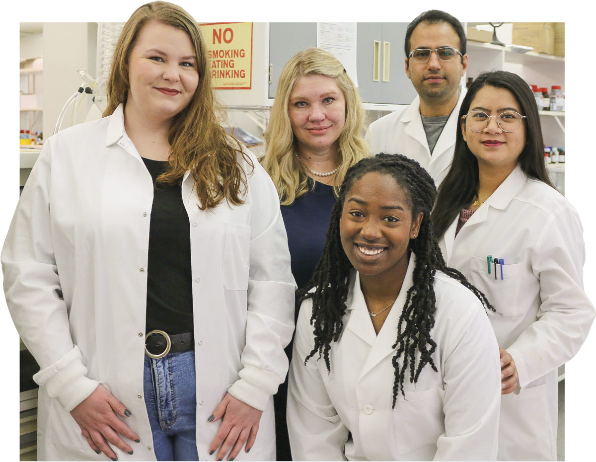 Nadia German, PhD, center, with her lab team. 