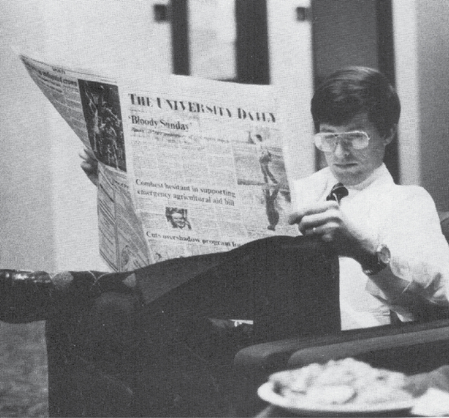 Student reading the school newspaper