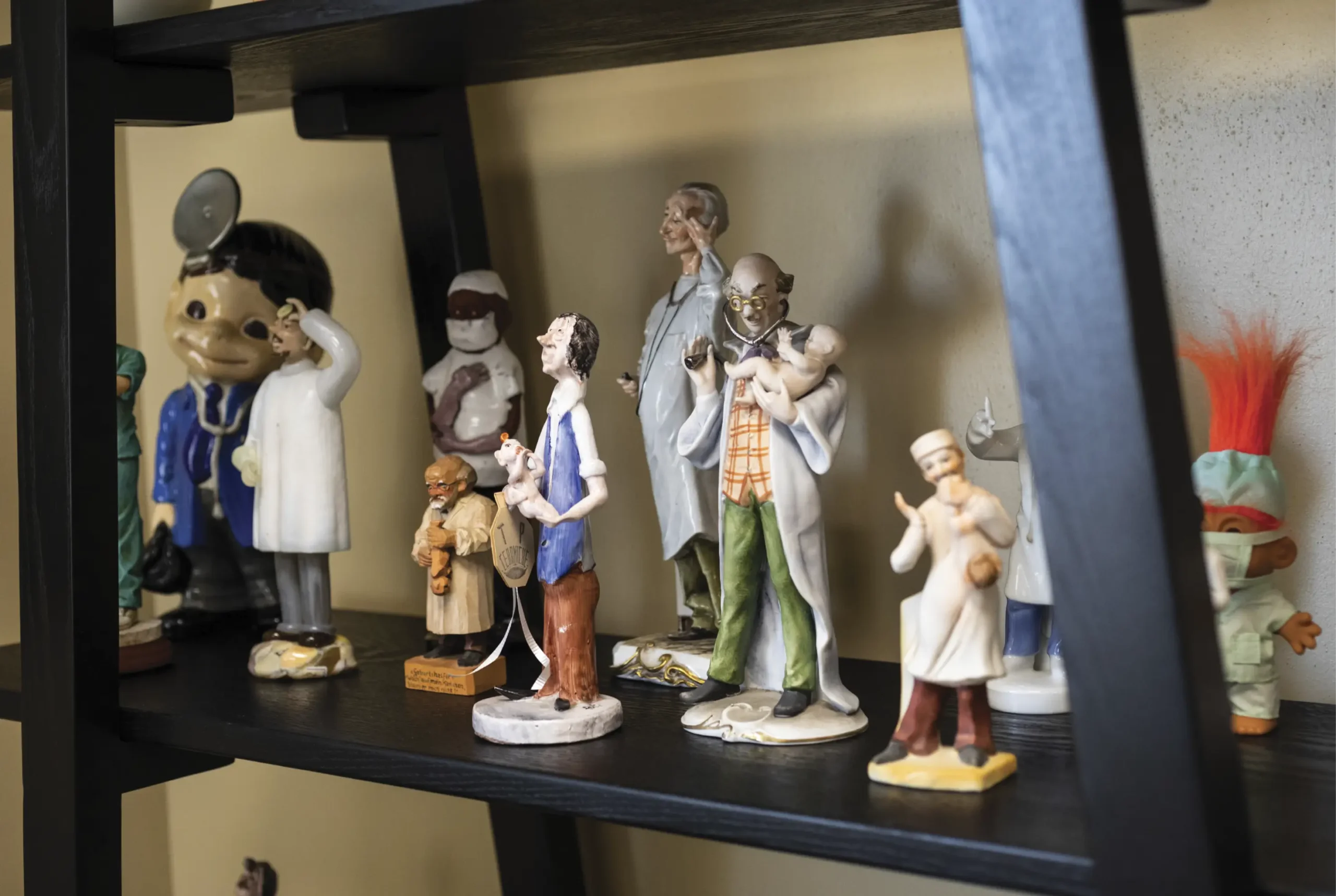 Group of assorted figurines on shelf