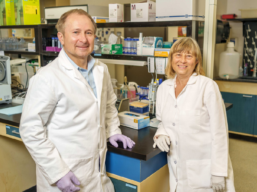 Andrey L. Karamyshev and Zemfira N. Karamysheva in lab coats smiling side by side in lab