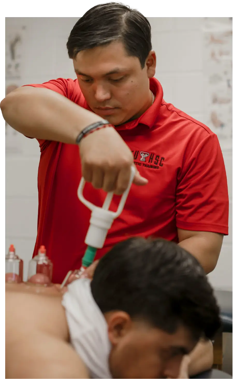 Edgar Garza provides cupping therapy on a patient