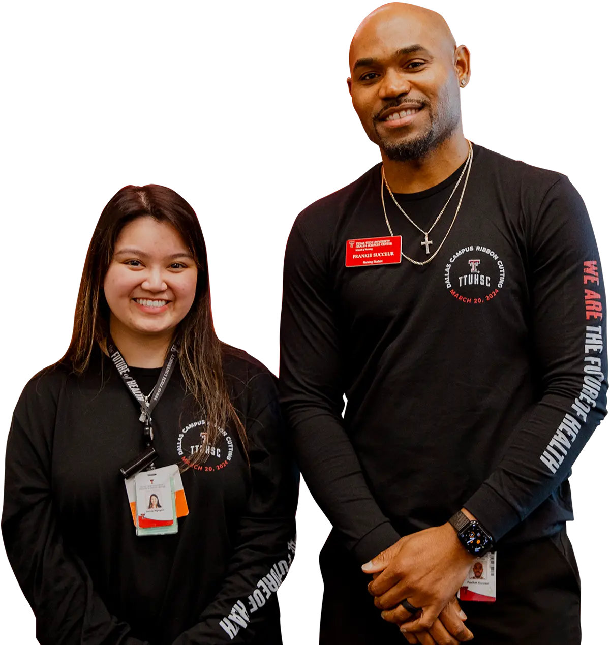 a female and male TTUHSC student stand side by side for a photo, both wearing a name tag and long sleeve, TTUHSC branded black shirts that read “We are the future of health” along the arm