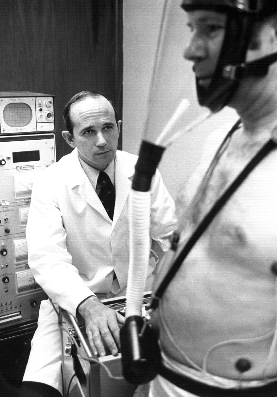 black and white photo of Kenneth performing a health test on a patient