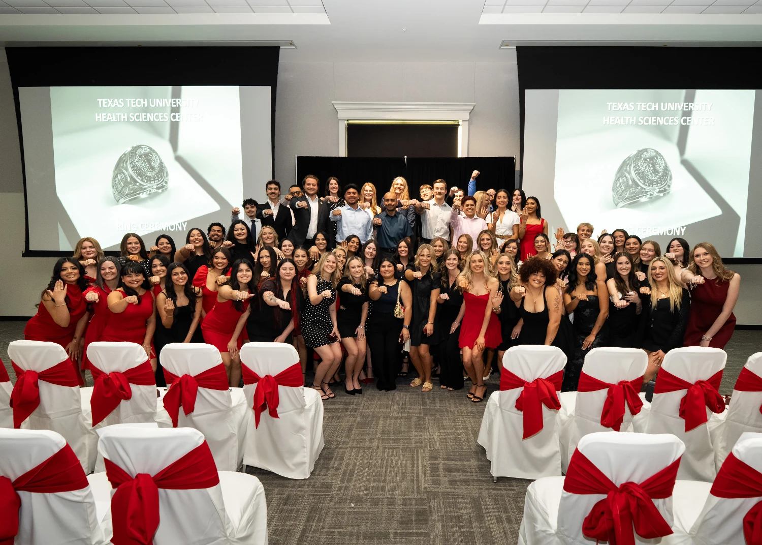 Texas Tech University Health Sciences Center students and faculty display their rings during a ring ceremony.
