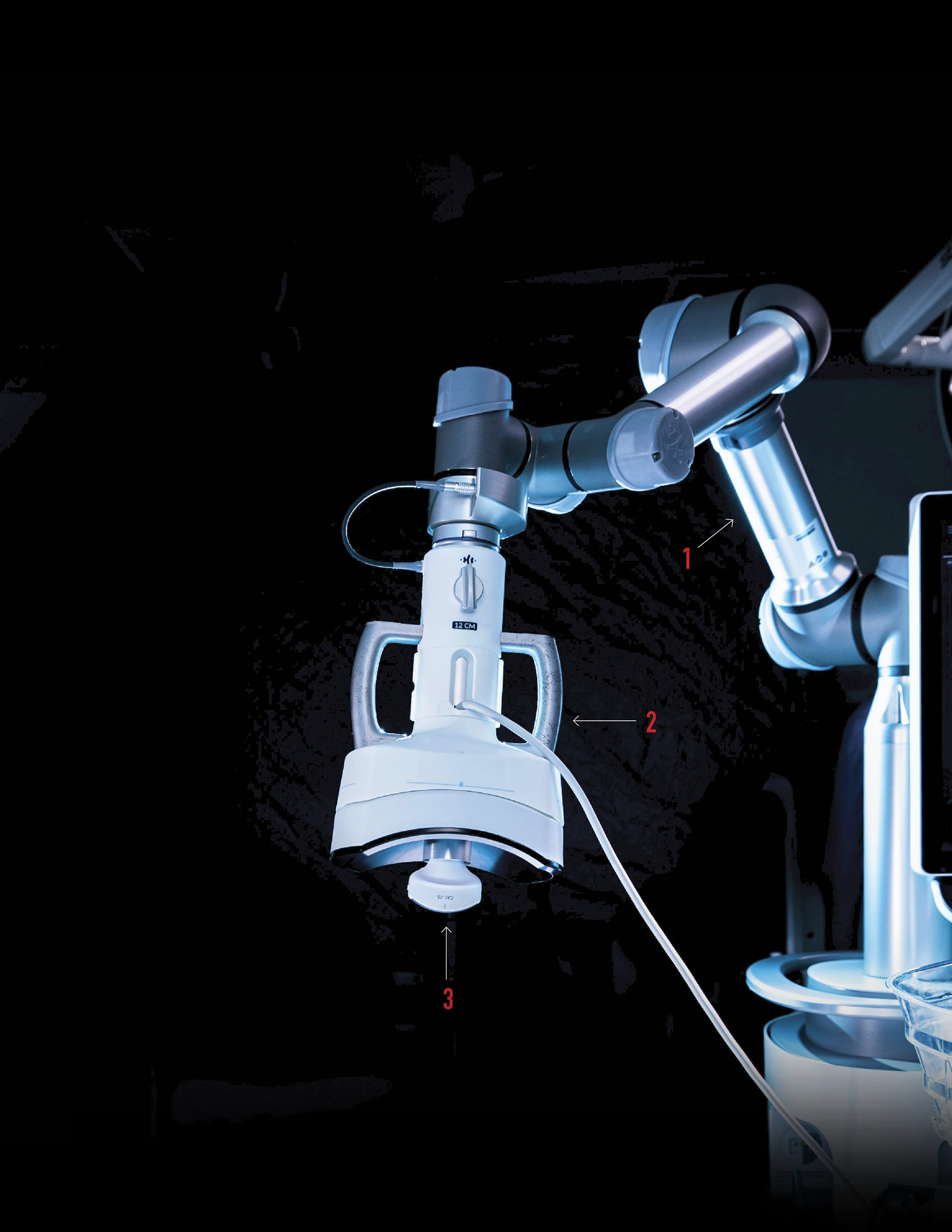 Close-up of a medical robotic arm with numbered callouts identifying three components against a dark background.